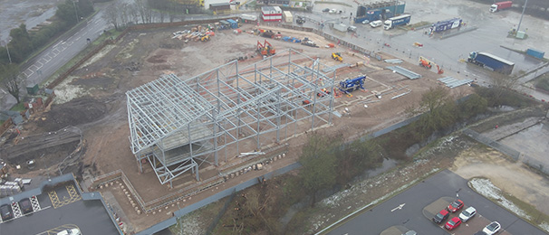 Image taken from a drone of a construction site after the installation of a steel frame.