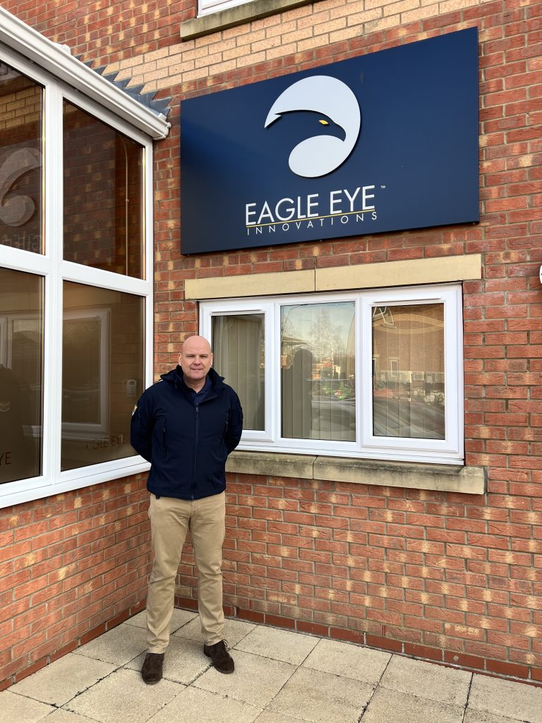 Man in uniform stood in front of Eagle Eye Innovations office.