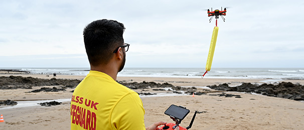 Lifeguard flying drone with life saving floatation device attached.