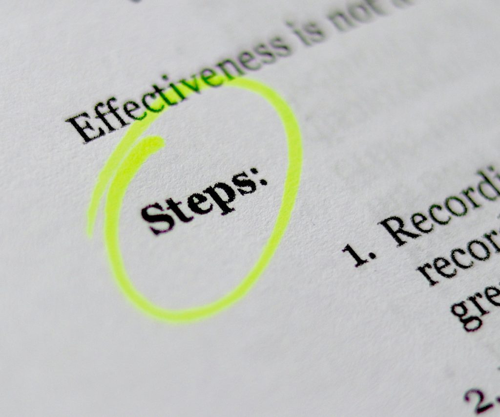 Business paper with the word 'steps' highlighted.